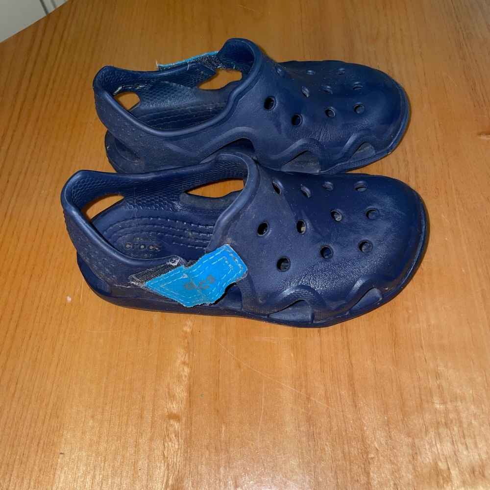 Dark blue little kid crocs. In good used condition.
